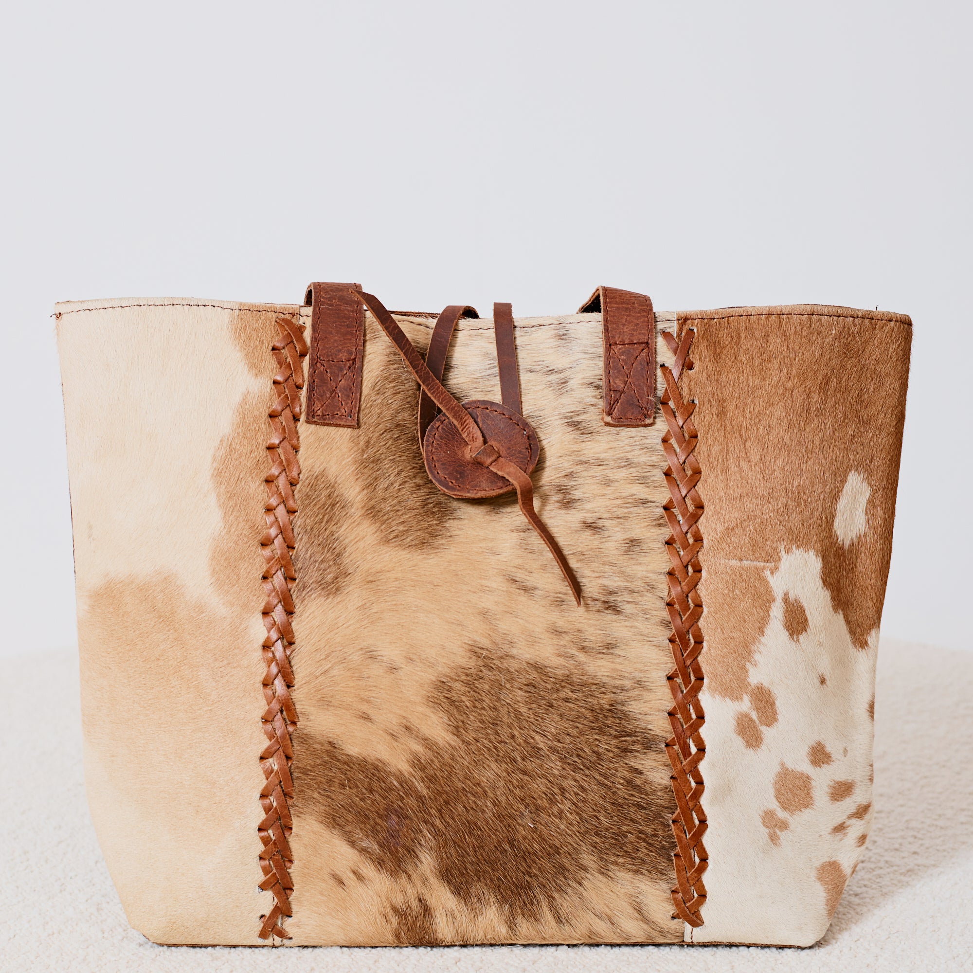 Sac à main western en poil de vache tressé
