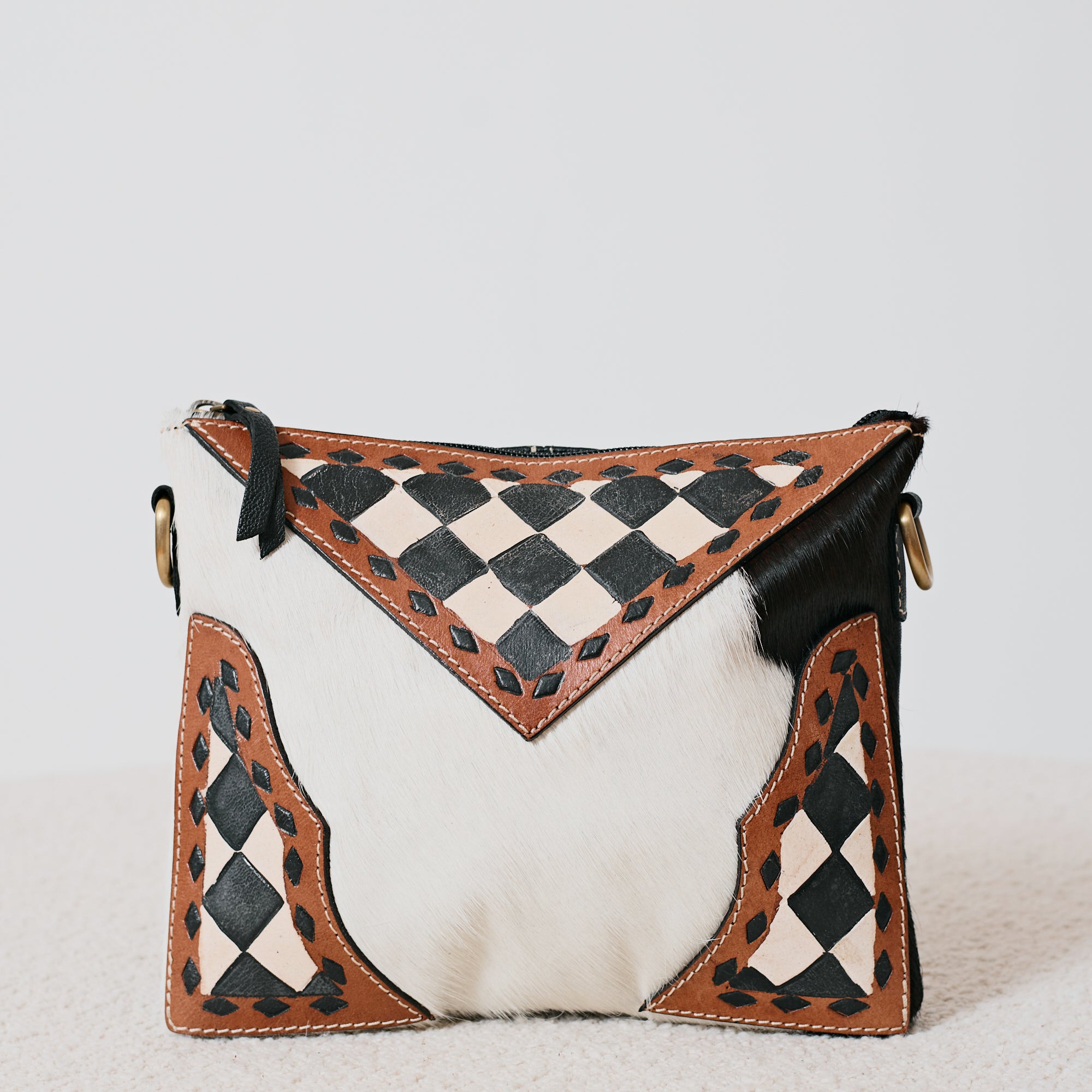 Pochette western damier en poil de vache