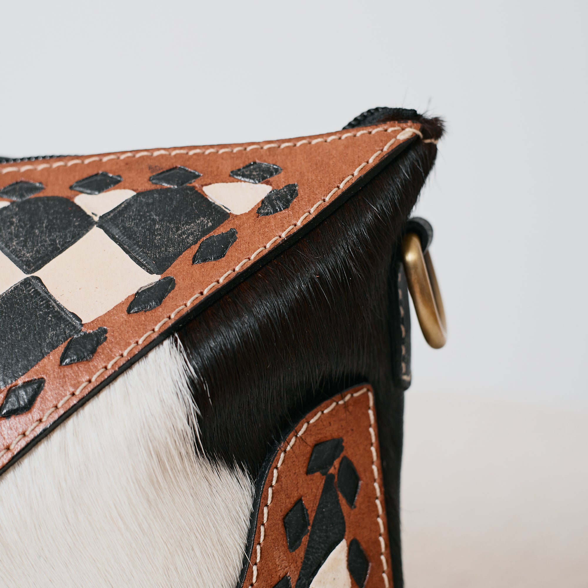 Pochette western damier en poil de vache