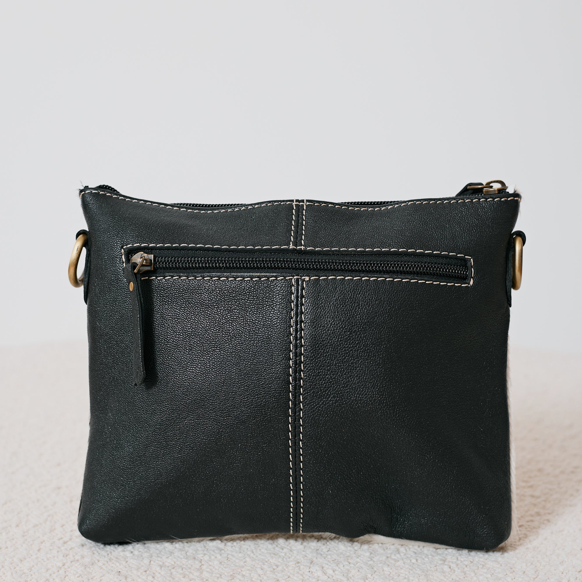 Pochette western damier en poil de vache