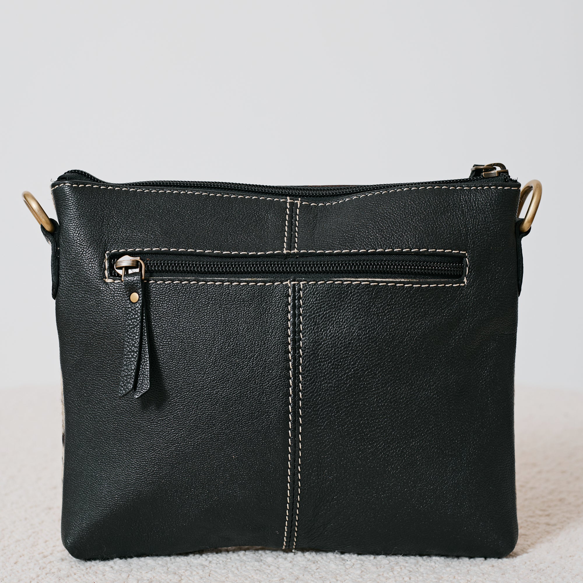 Pochette western damier en poil de vache