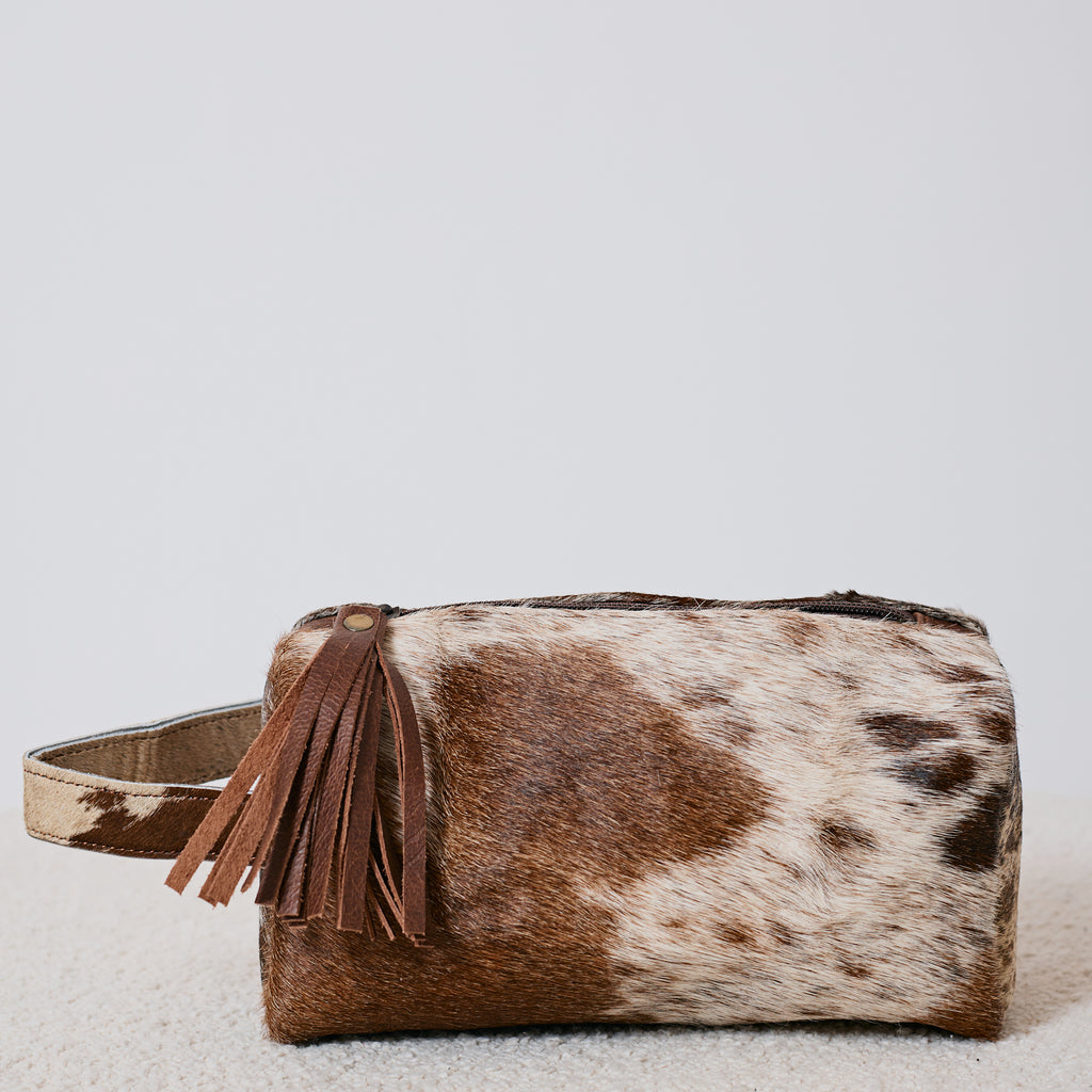 Pochette western en poil de vache avec pompon