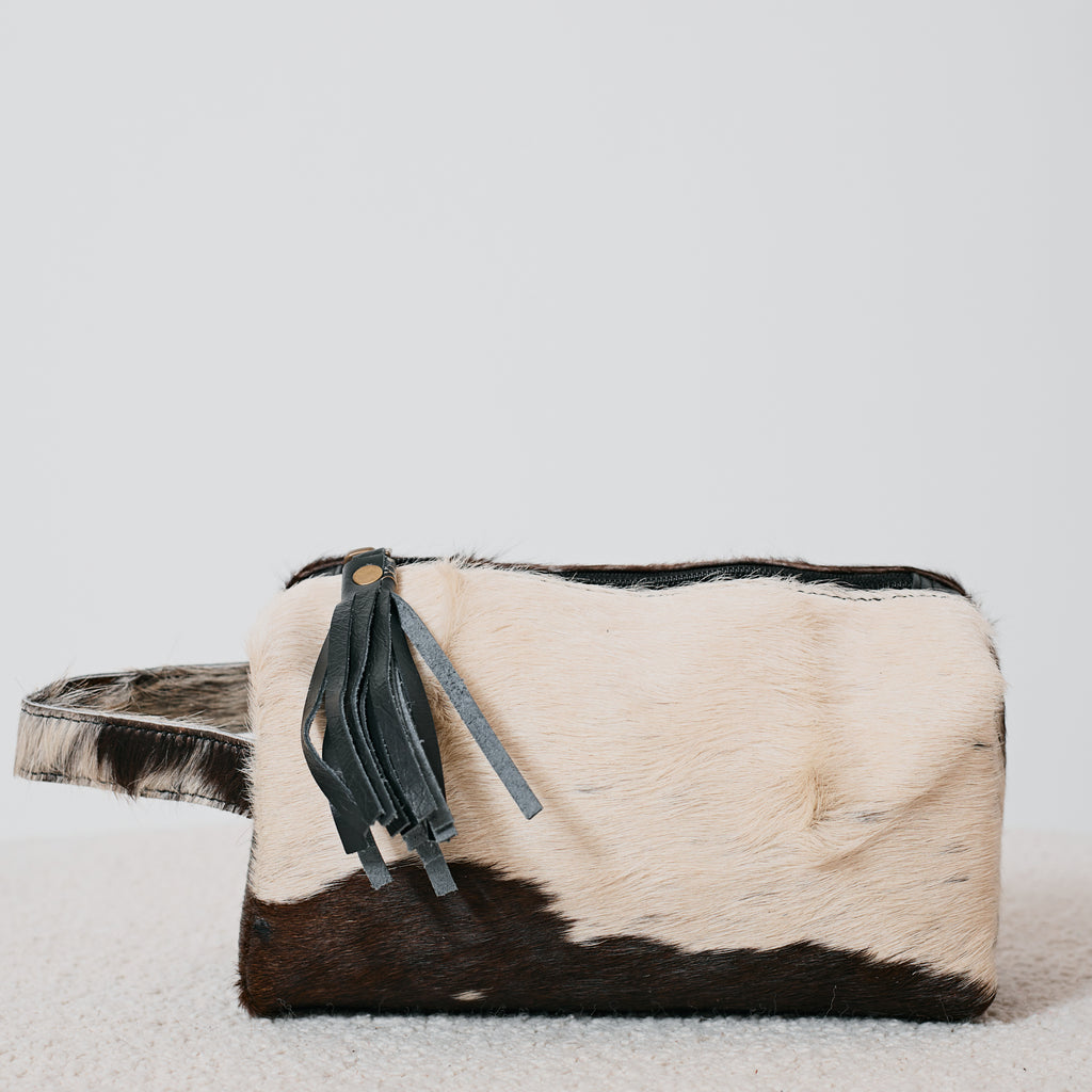 Pochette western en poil de vache avec pompon